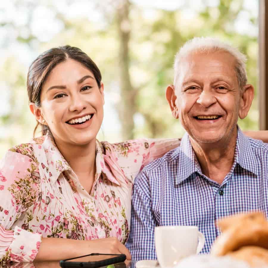 Latino Senior with young family member